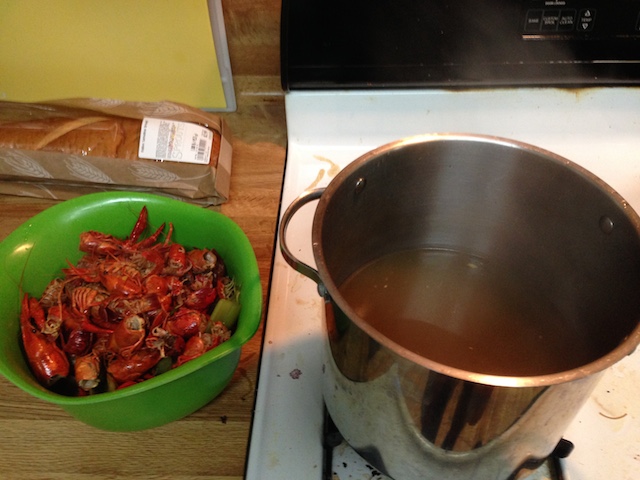 Left: crawfish bodies and stock veggies in a bowl. Right: my precious stock.