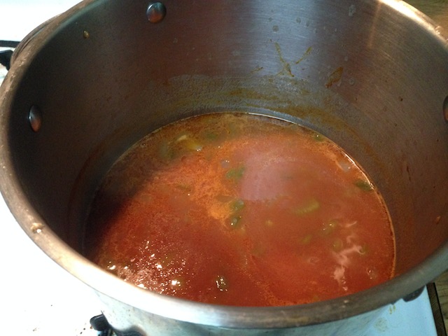 Pot with stock, roux, and veggies.