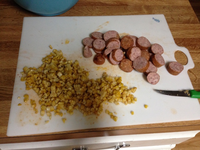 Top: sausage sliced into rounds. Bottom: corn kernels.