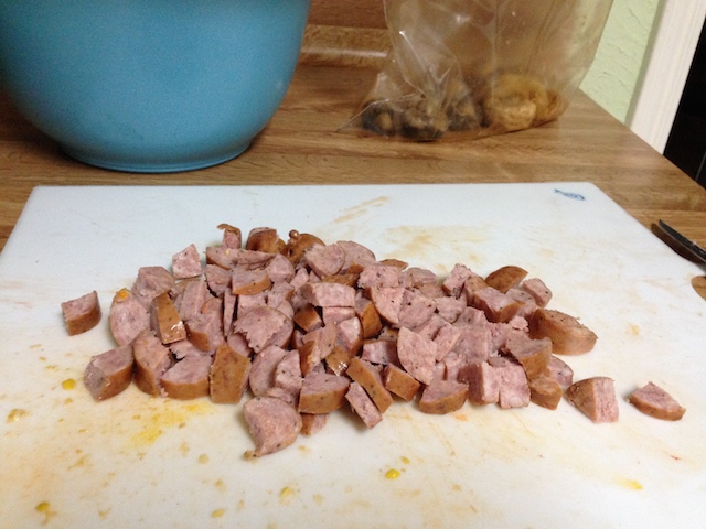 Top: sausage sliced into rounds. Bottom: corn kernels.